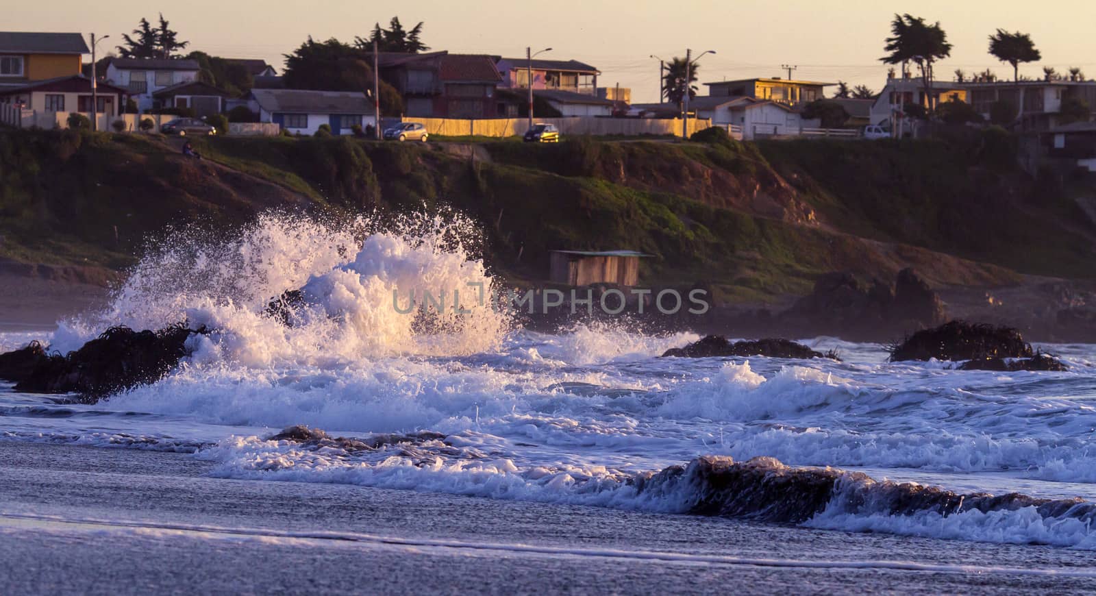 Colorful ocean waves at sunset in Chile