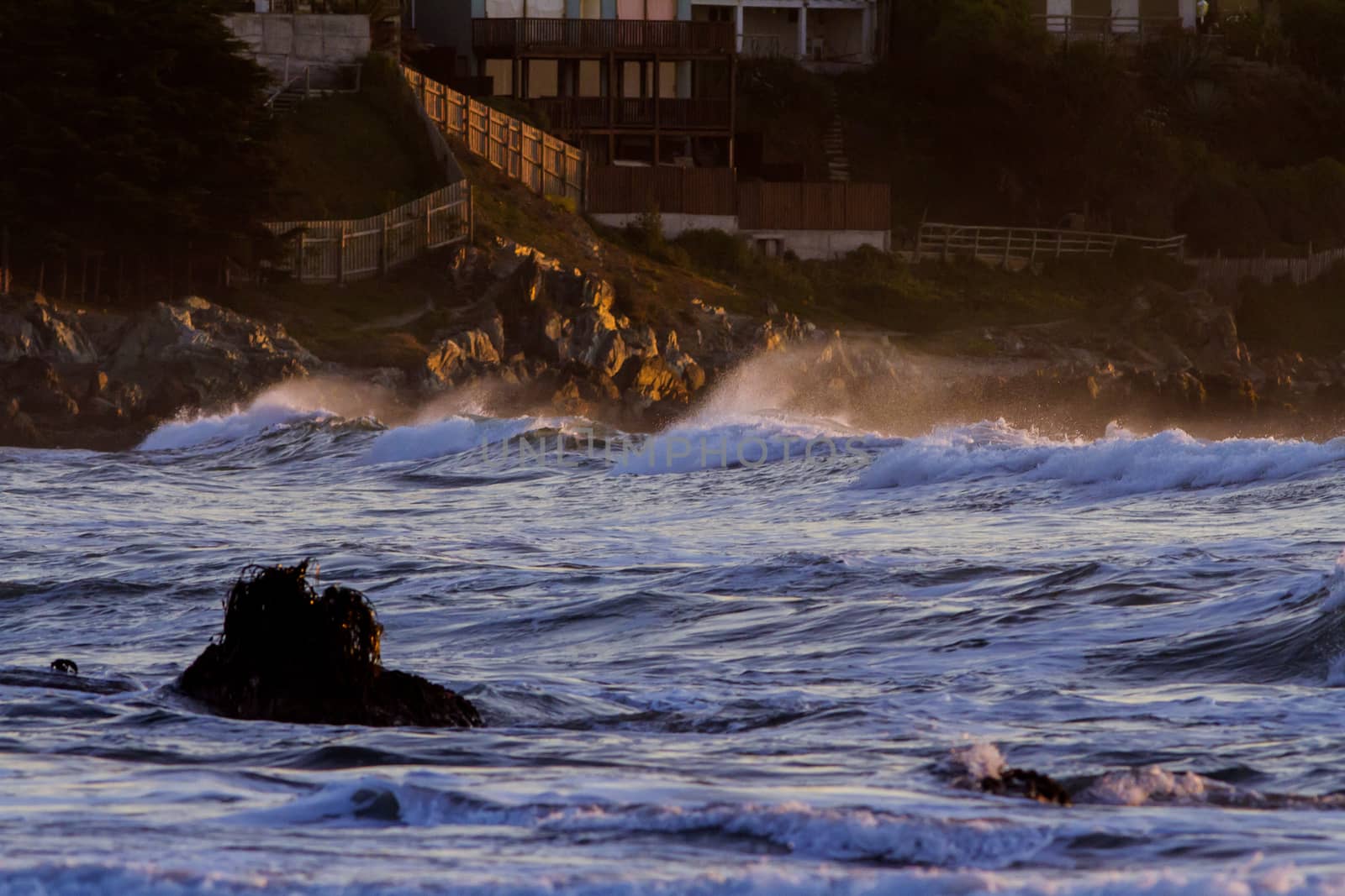 Colorful ocean waves at sunset in Chile