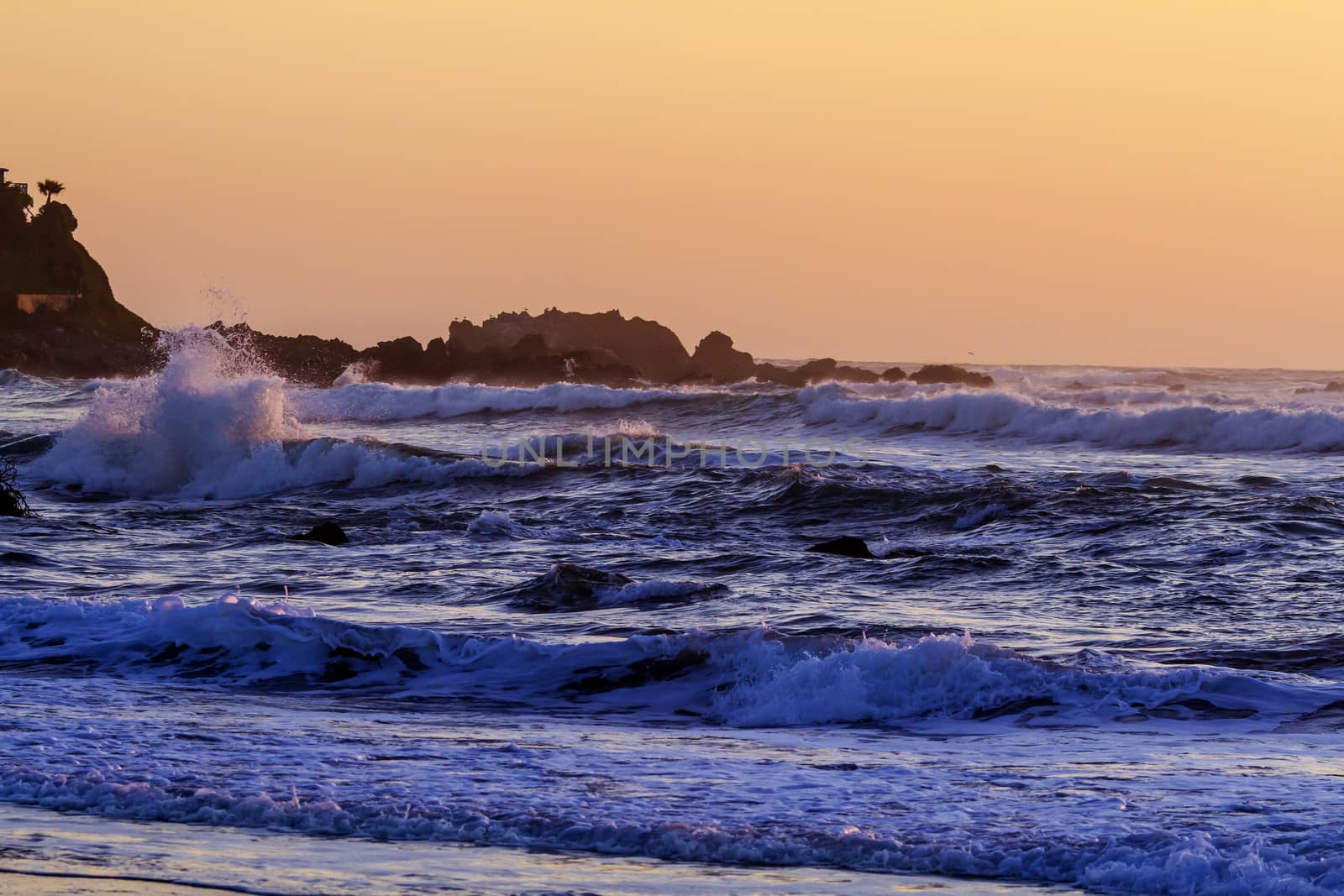 Colorful ocean waves at sunset in Chile