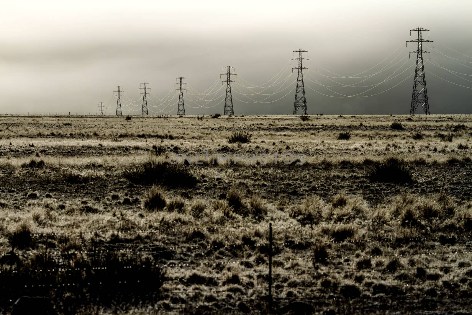 Landscape with a power line and thunder sky