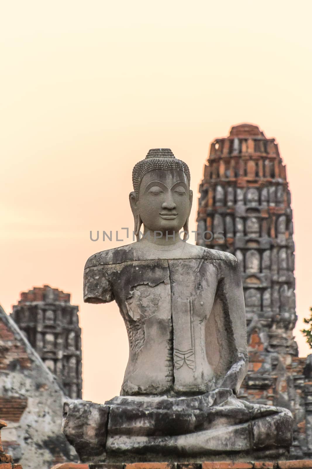 Ancient Buddha statue in Wat Chaiwatthanaram, an old temple in Ayutthaya Historical Park, Ayutthaya, Thailand.