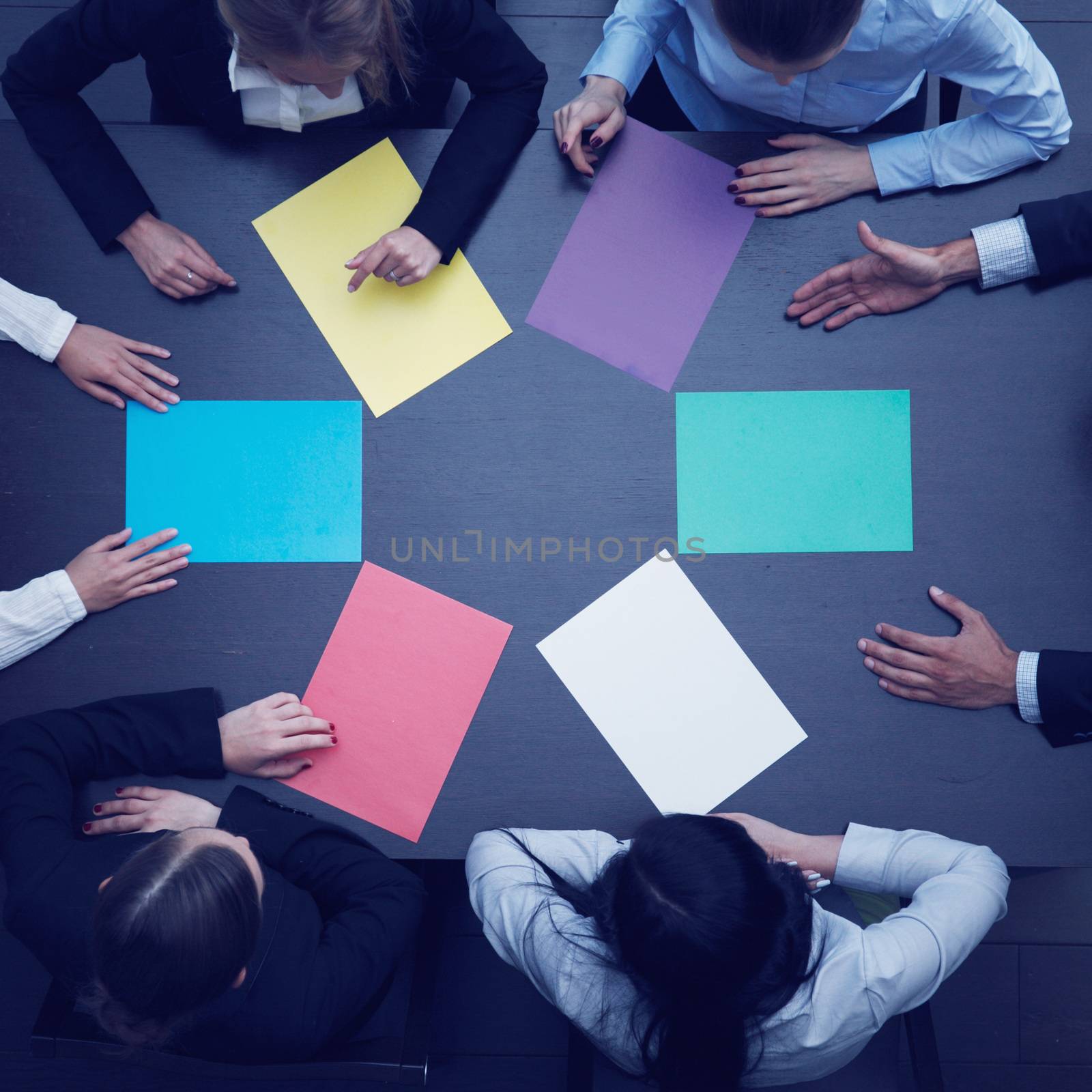 Business people and color paper by ALotOfPeople