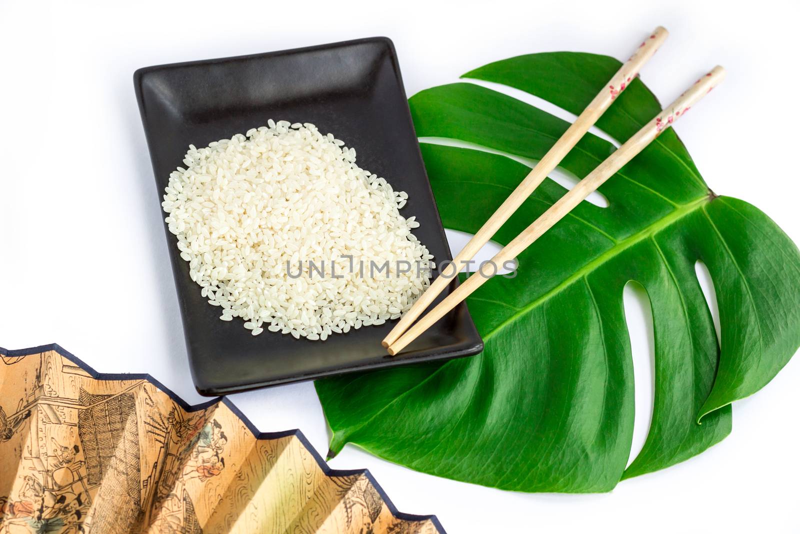 Oriental set of rice, chopsticks, green leaf and transp  isolated on white background