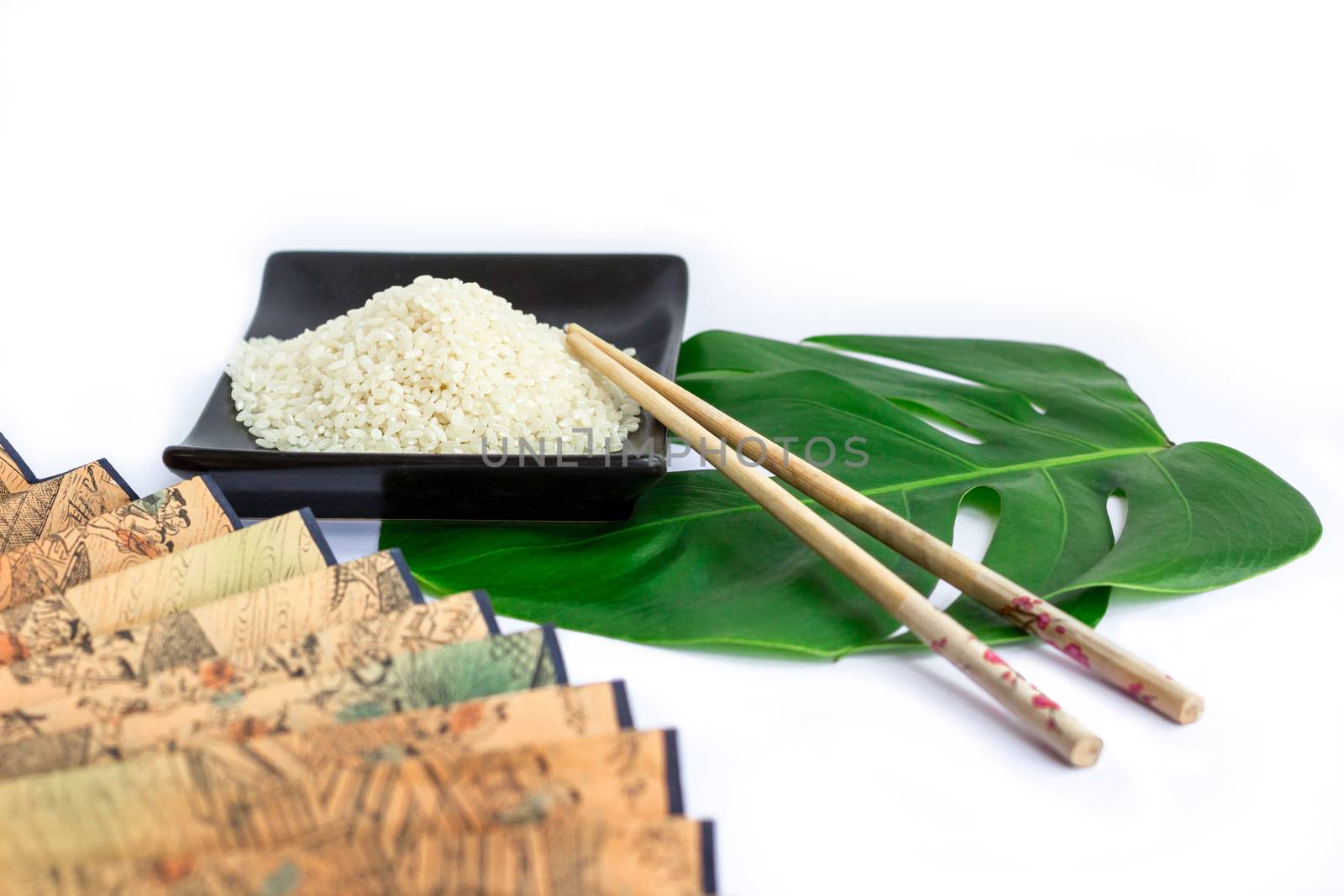 Oriental set of rice, chopsticks, green leaf and transp  isolated on white background