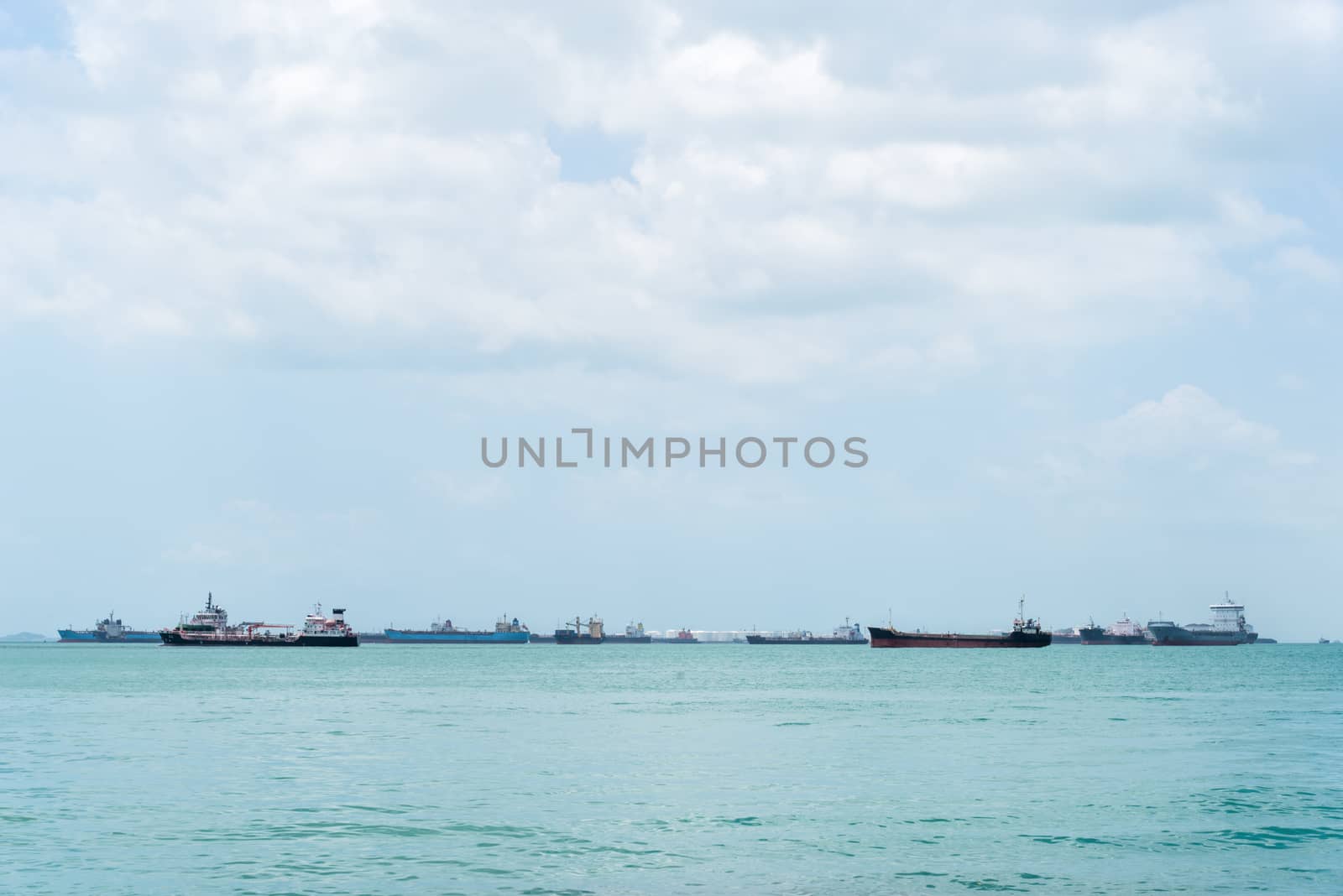 Container ship at anchor on the horizon