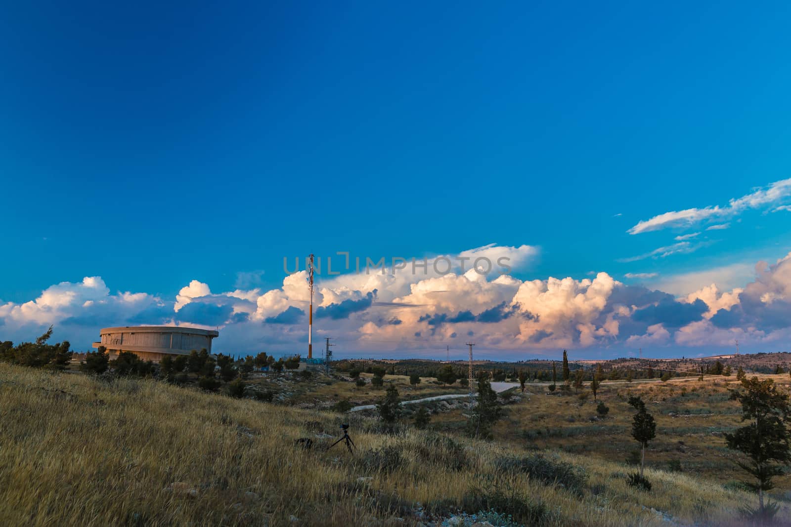 countryside views, water tower on the sunset background