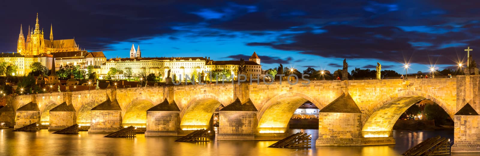Pargue sunset, view of the Lesser Bridge Tower of Charles Bridge (Karluv Most) and Prague Castle, Czech Republic.