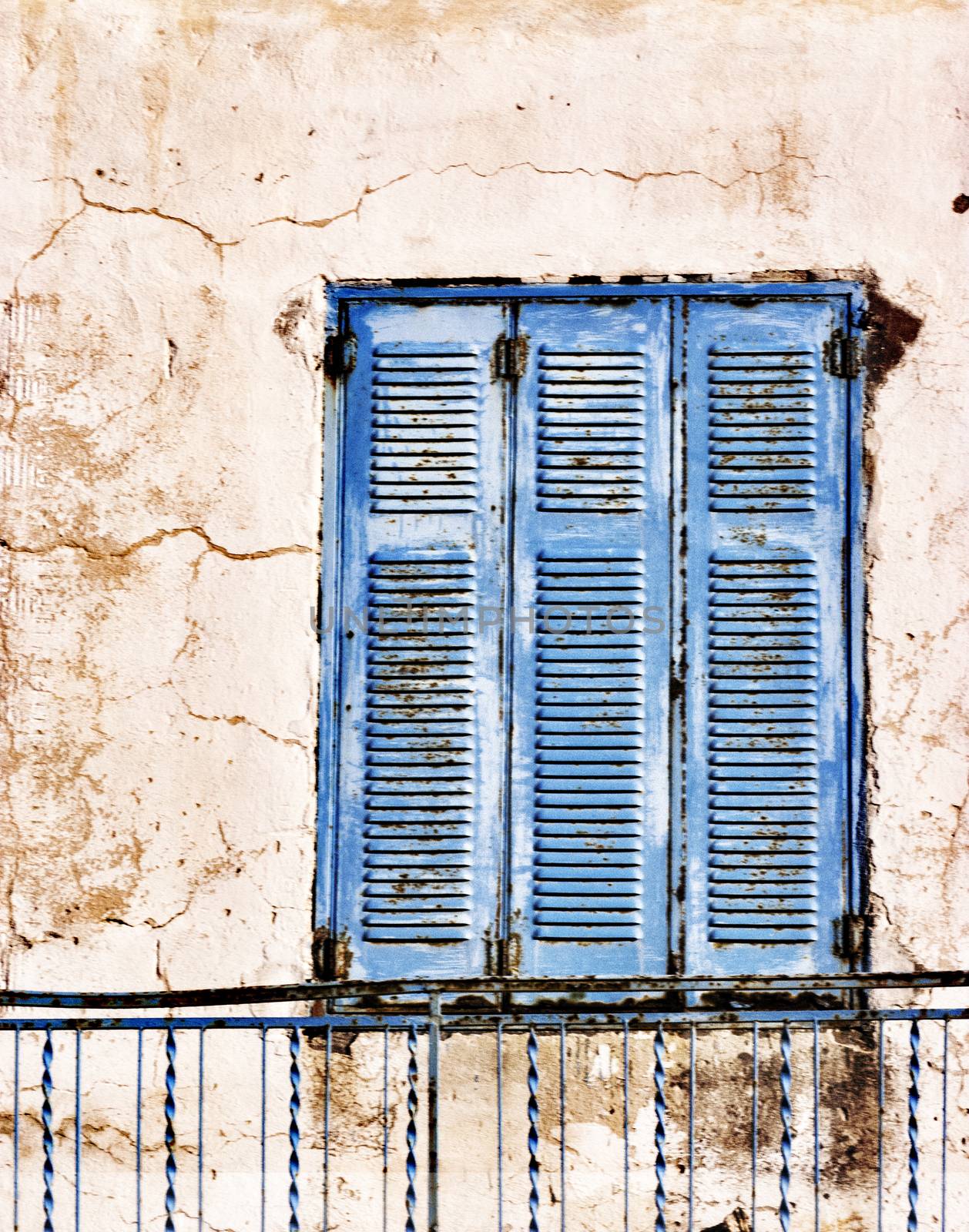 Old, weathered blue wooden window shutter by ankarb