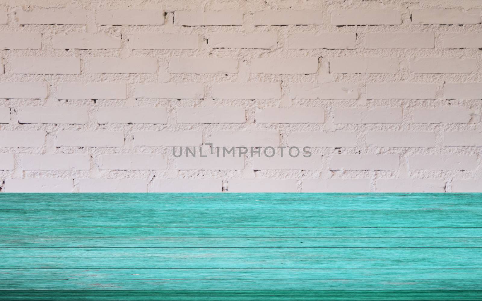 Top of blue wooden table with white brick wall decorated in coffee shop