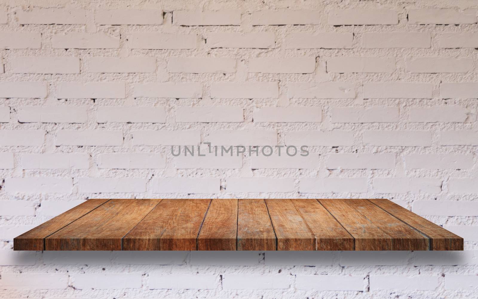 Top of wooden shelf with white brick wall decorated in coffee shop