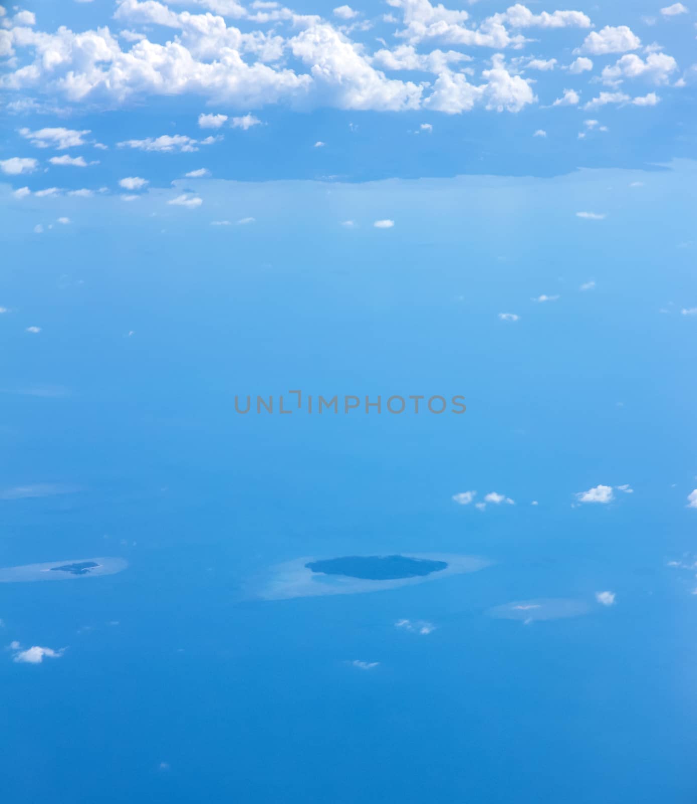 Soft clouds over view from airplane flying