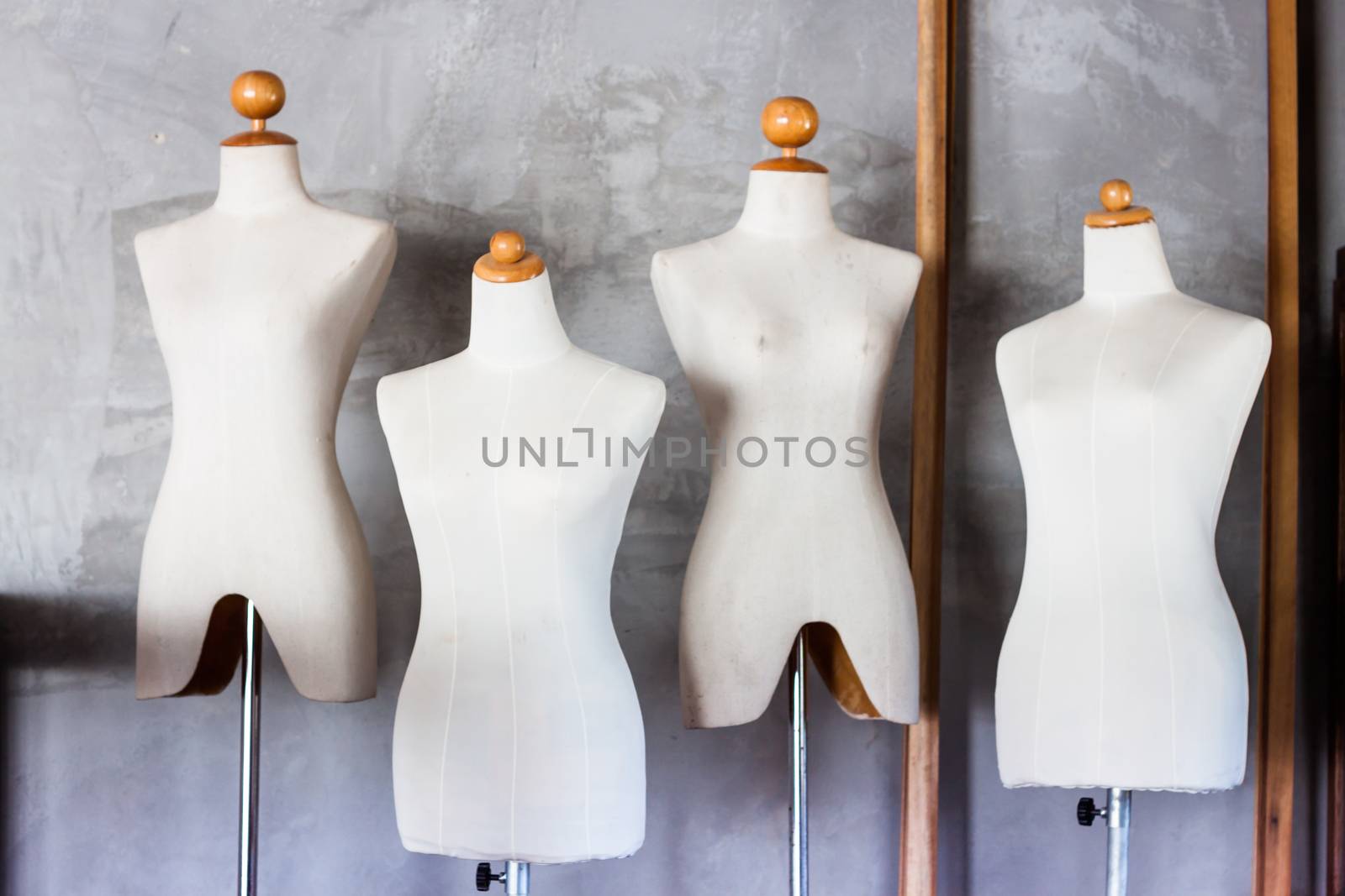 Mannequin tailors in storage room with vintage filter, stock photo