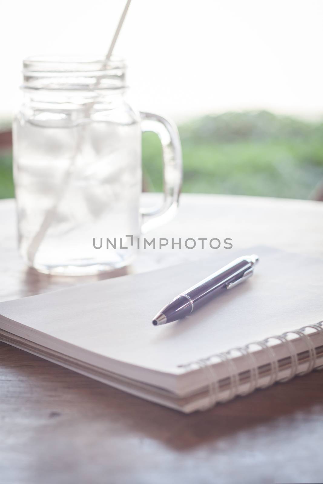 Work station with notebook and pen, stock photo