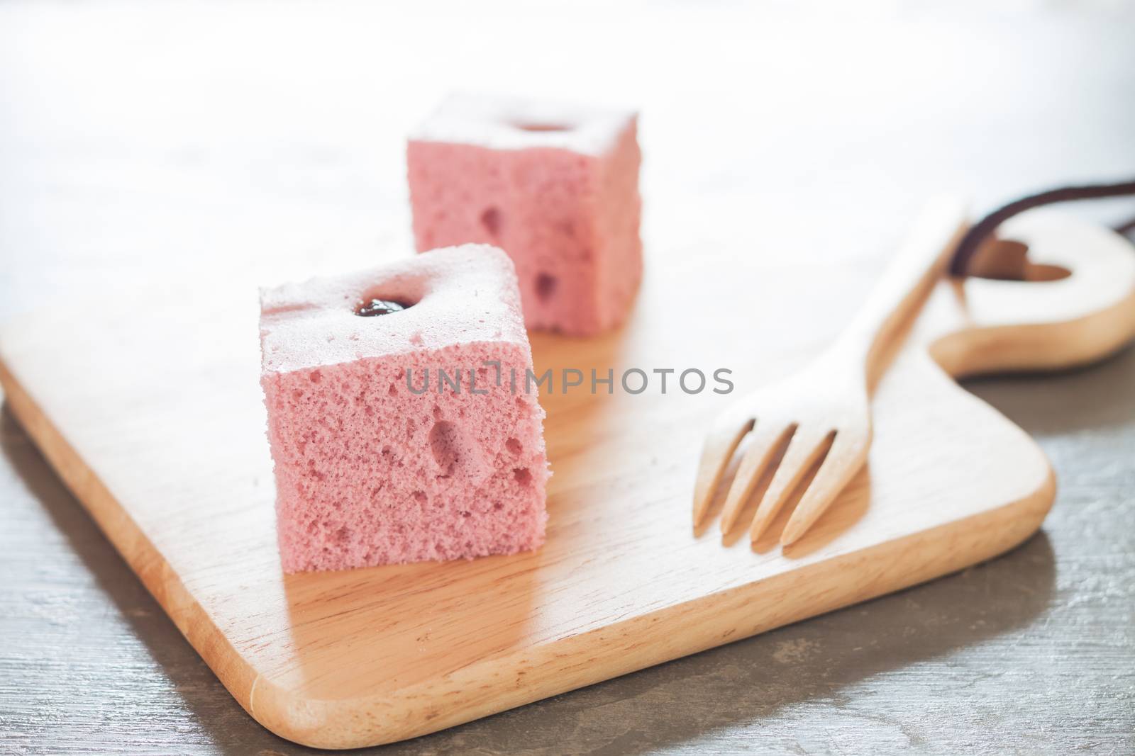 Steamed cake on wooden plate, stock photo