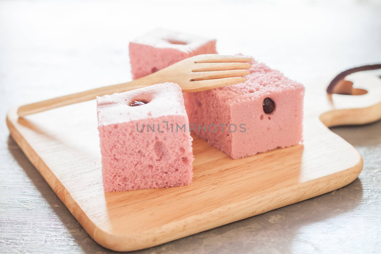 Steamed cake on wooden plate, stock photo