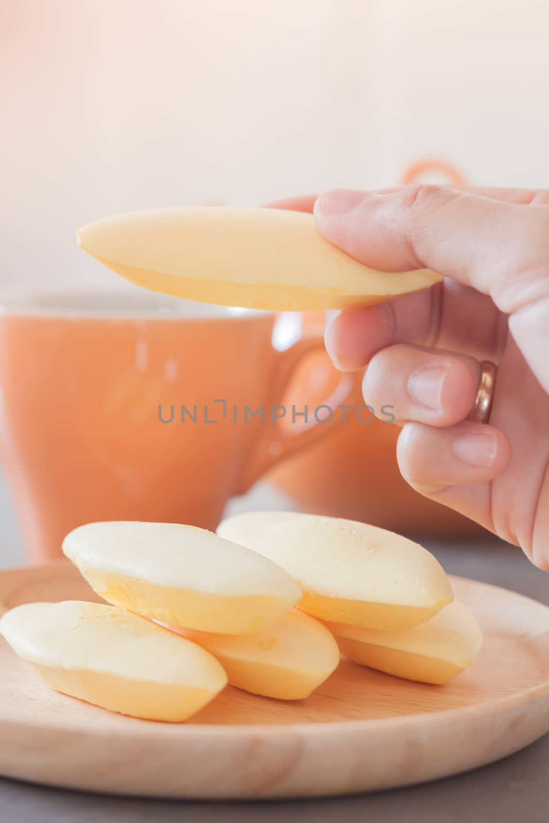 Woman's hand holding traditional Thai cookies  by punsayaporn