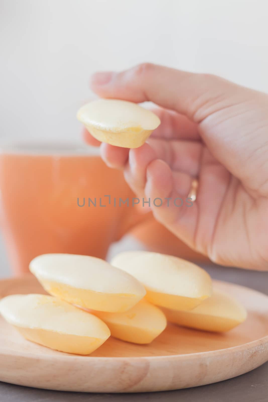 Woman's hand holding traditional Thai cookies  by punsayaporn