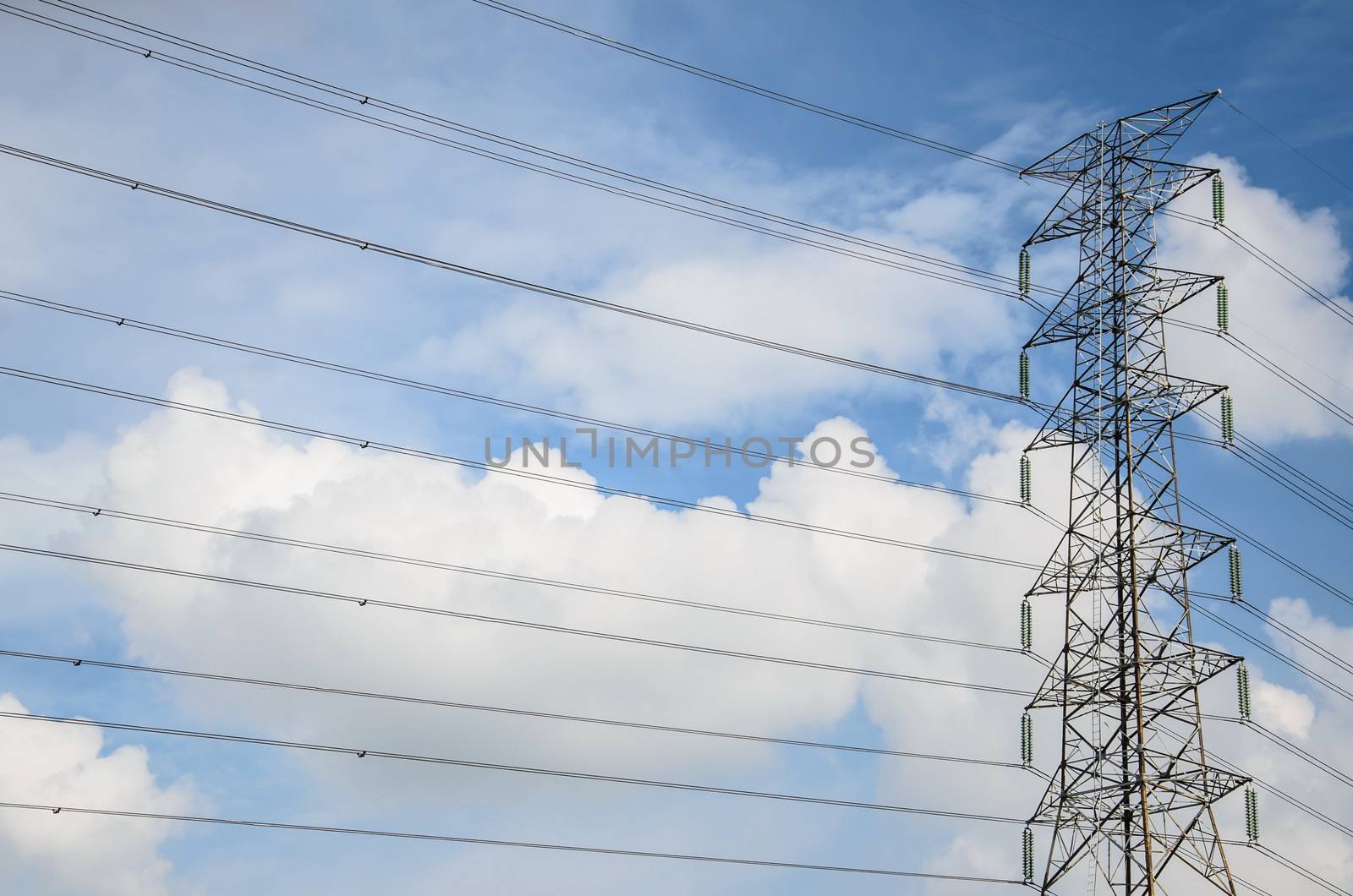 Electric tower ultra wide angle over blue sky with clouds in Thailand
