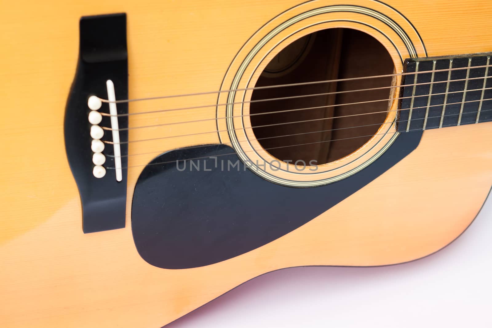 Acoustic guitar on white background, stock photo