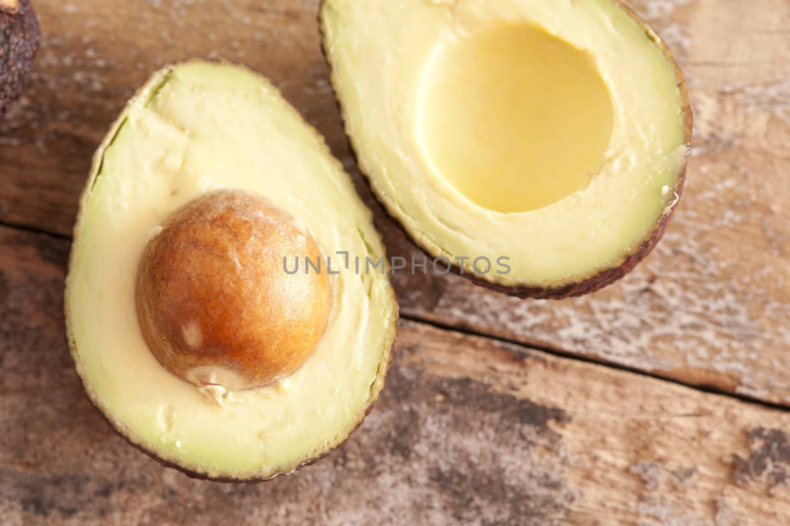 Ripe fresh halved avocado pear by stockarch