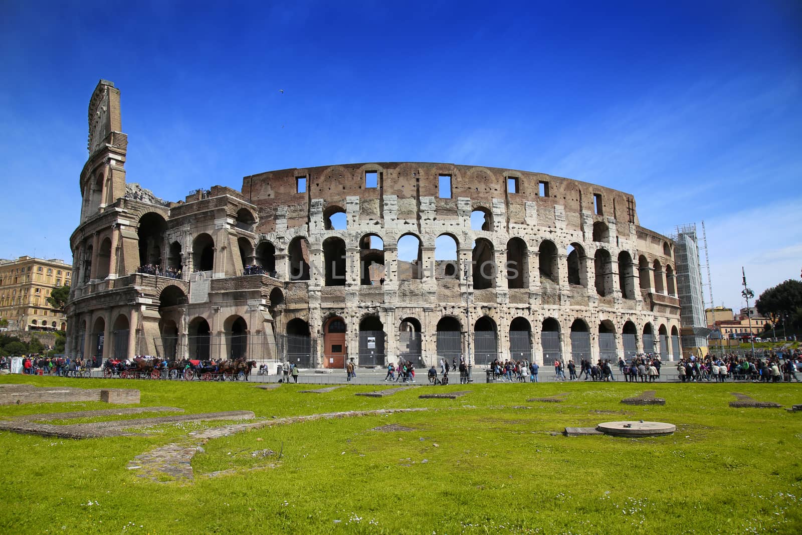 ROME, ITALY - APRIL 08: Many tourists visiting The Colosseum in Rome, Italy. Rome is the capital of Italy and region of Lazio. Italy on April 08, 2015.