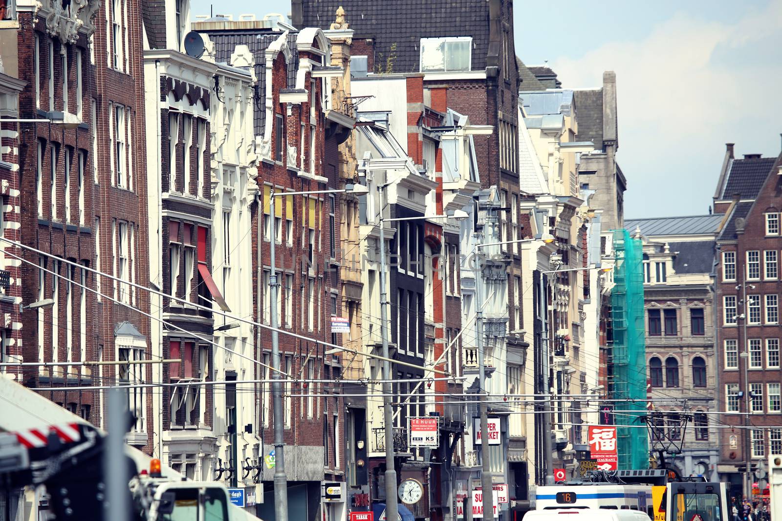 AMSTERDAM, THE NETHERLANDS - AUGUST 19, 2015: Rokin street with row of shops; restaurants and Dam Square. Amsterdam is capital of the Netherlands on August 19, 2015.