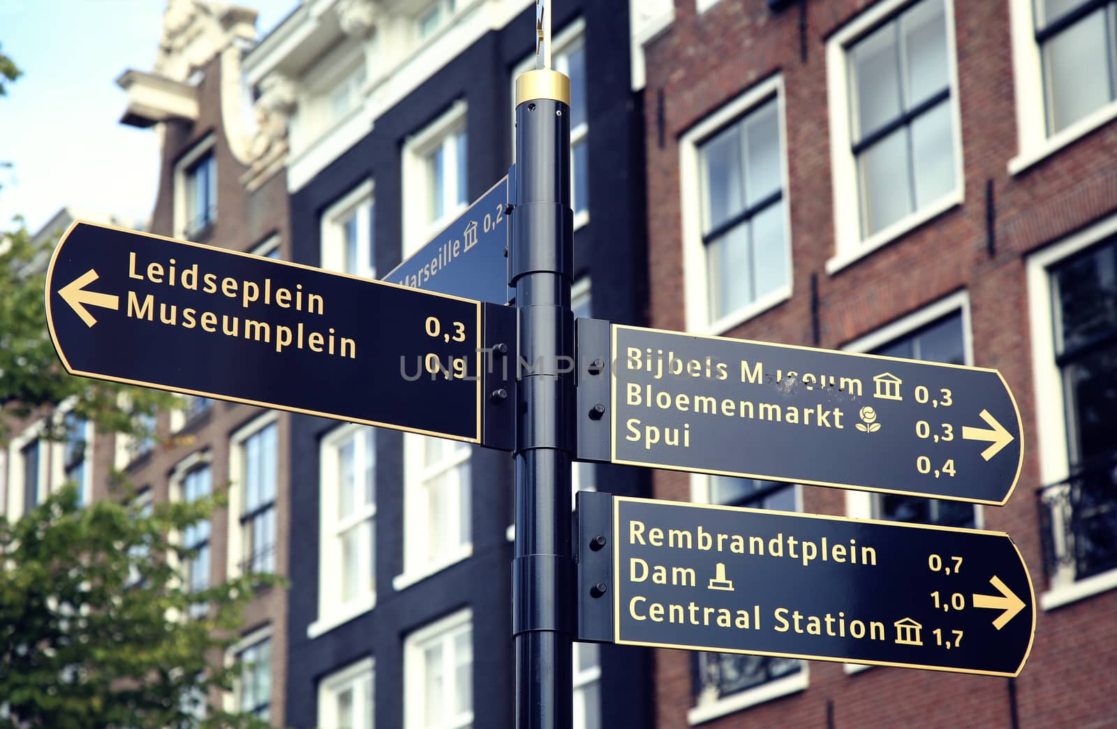 AMSTERDAM; THE NETHERLANDS - AUGUST 19; 2015: Tourist signpost street indicating an interesting excursion in Amsterdam. Amsterdam is capital of the Netherlands on August 19; 2015.