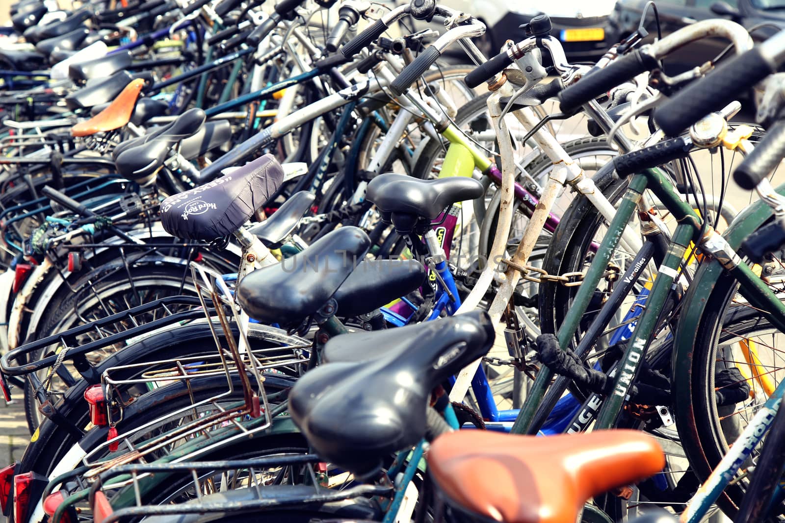 AMSTERDAM; THE NETHERLANDS - AUGUST 19; 2015: Lots of bicycles parked at the bike parking in Amsterdam. Amsterdam is capital of the Netherlands on August 19; 2015.