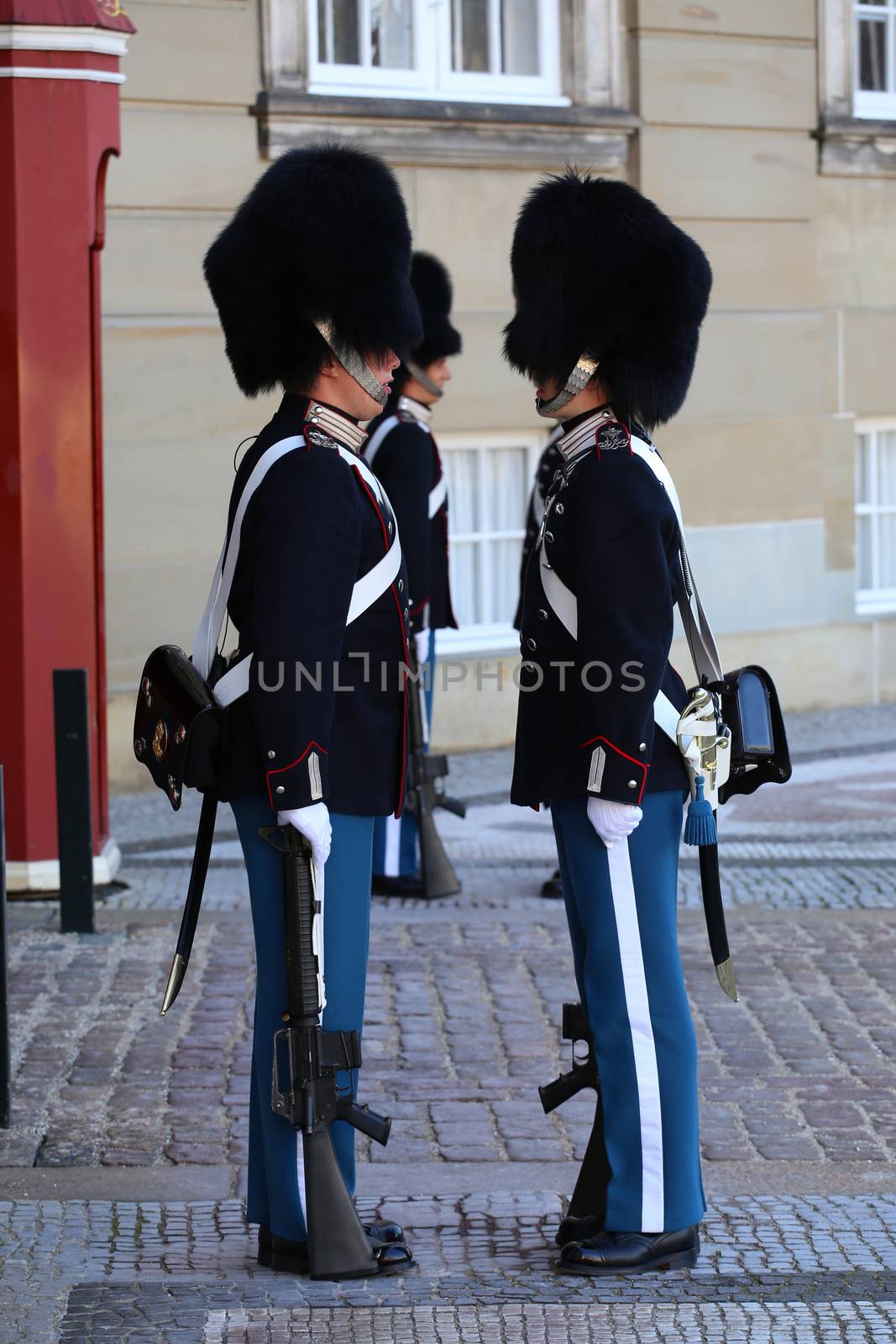 COPENHAGEN, DENMARK - AUGUST 15, 2016: Danish Royal Life Guards line up for the changing of the guards on the central plaza of Amalienborg palace in Copenhagen, Denmark on August 15, 2016.