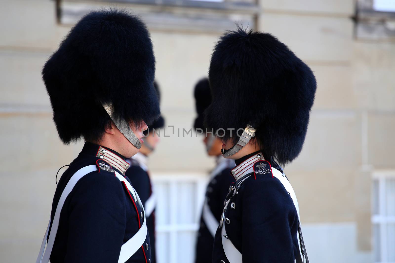 COPENHAGEN, DENMARK - AUGUST 15, 2016: Danish Royal Life Guards line up for the changing of the guards on the central plaza of Amalienborg palace in Copenhagen, Denmark on August 15, 2016.