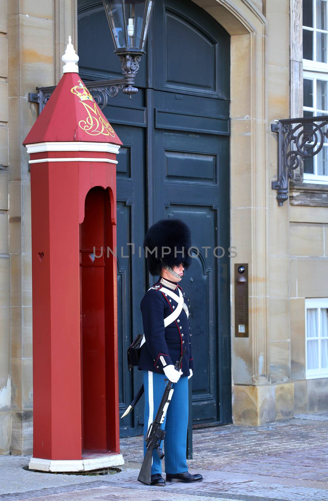 COPENHAGEN, DENMARK - AUGUST 15, 2016: Danish Royal Life Guard on the central plaza of Amalienborg palace, home of the Danish Royal family in Copenhagen, Denmark on August 15, 2016.