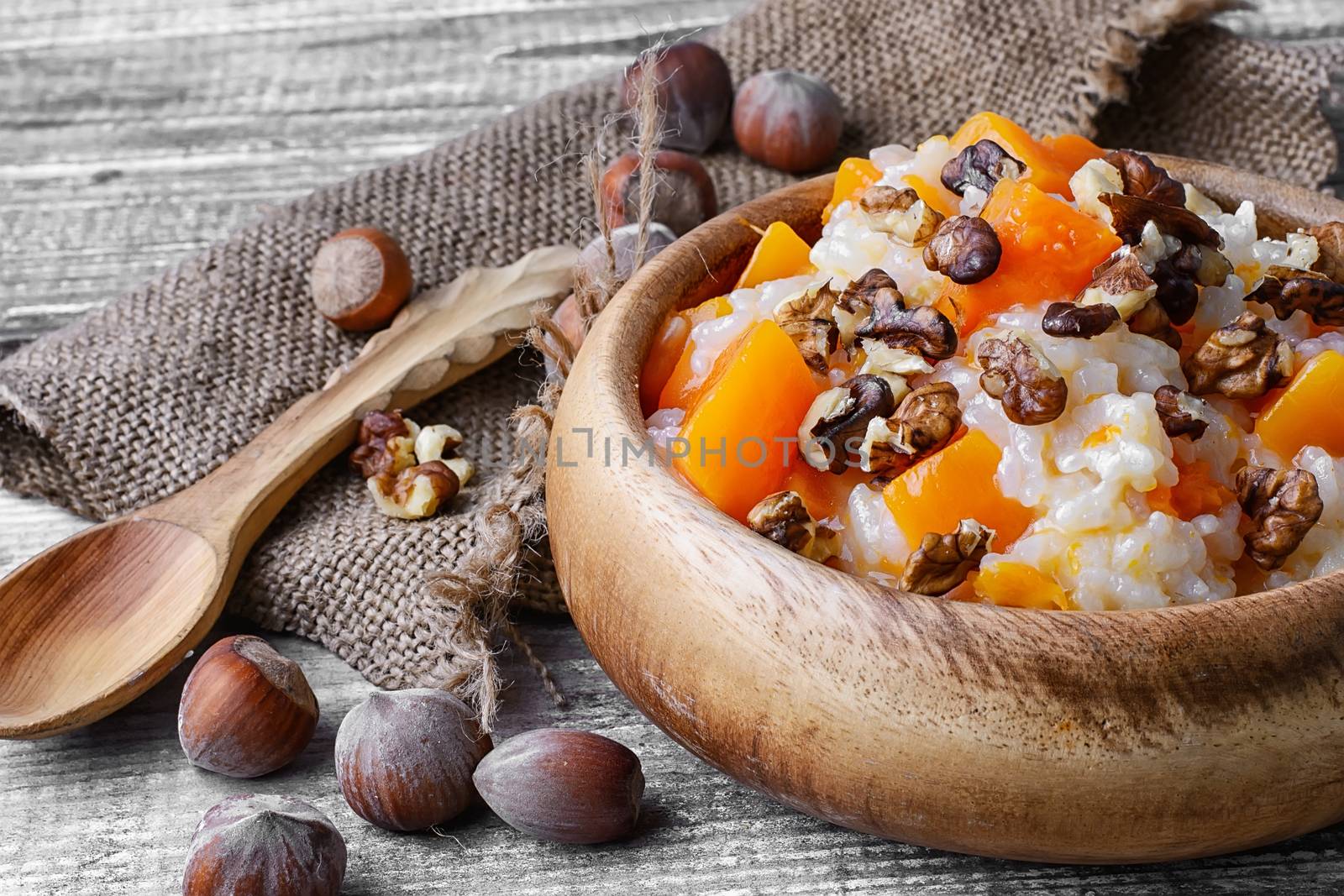 Traditional Russian dish, pumpkin porridge in wooden bowl