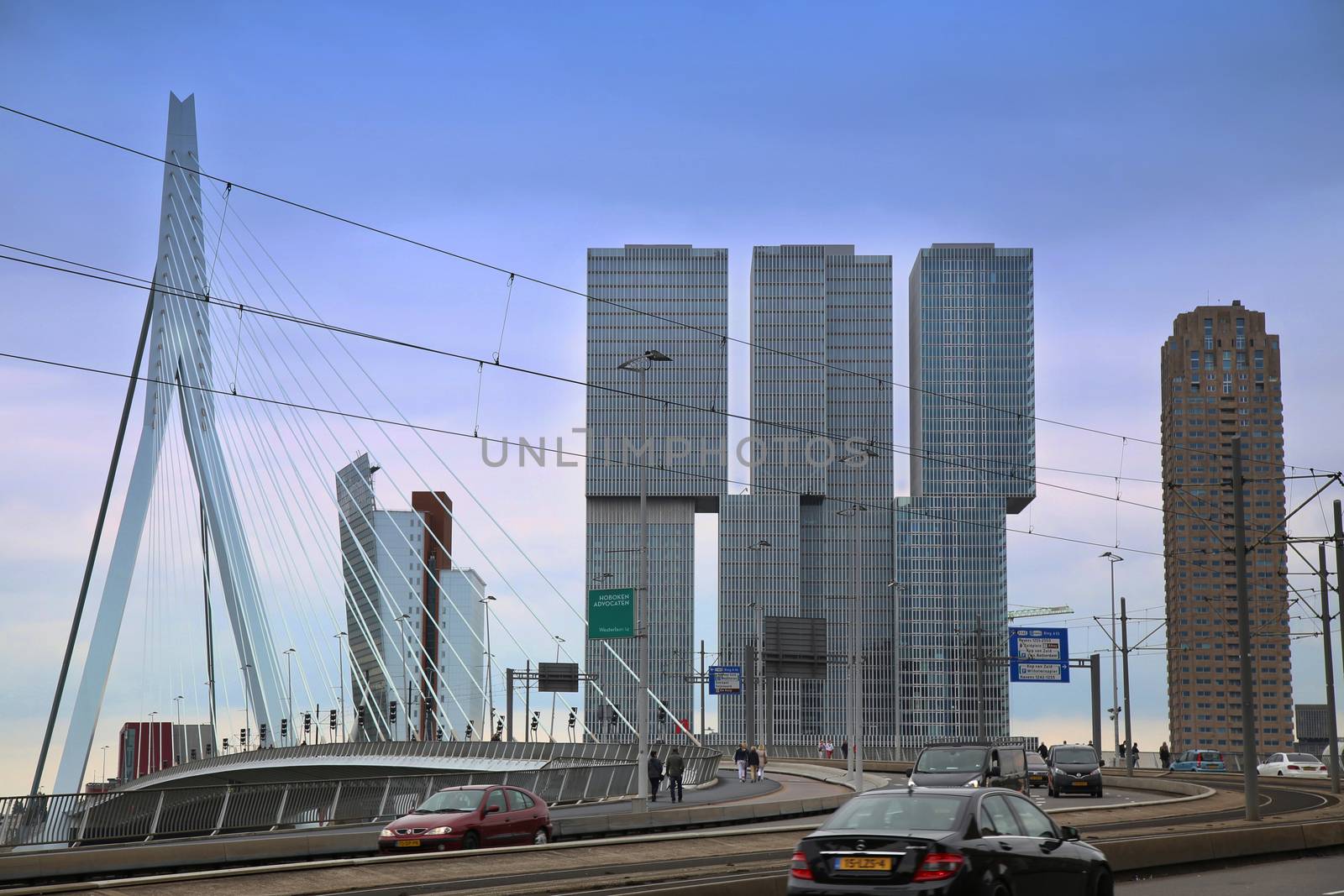 ROTTERDAM, THE NETHERLANDS - 18 AUGUST: Rotterdam is a city modern architecture, view on Erasmus Bridge and skyline of Rotterdam, river Maas in Rotterdam, Netherlands on August 18,2015.