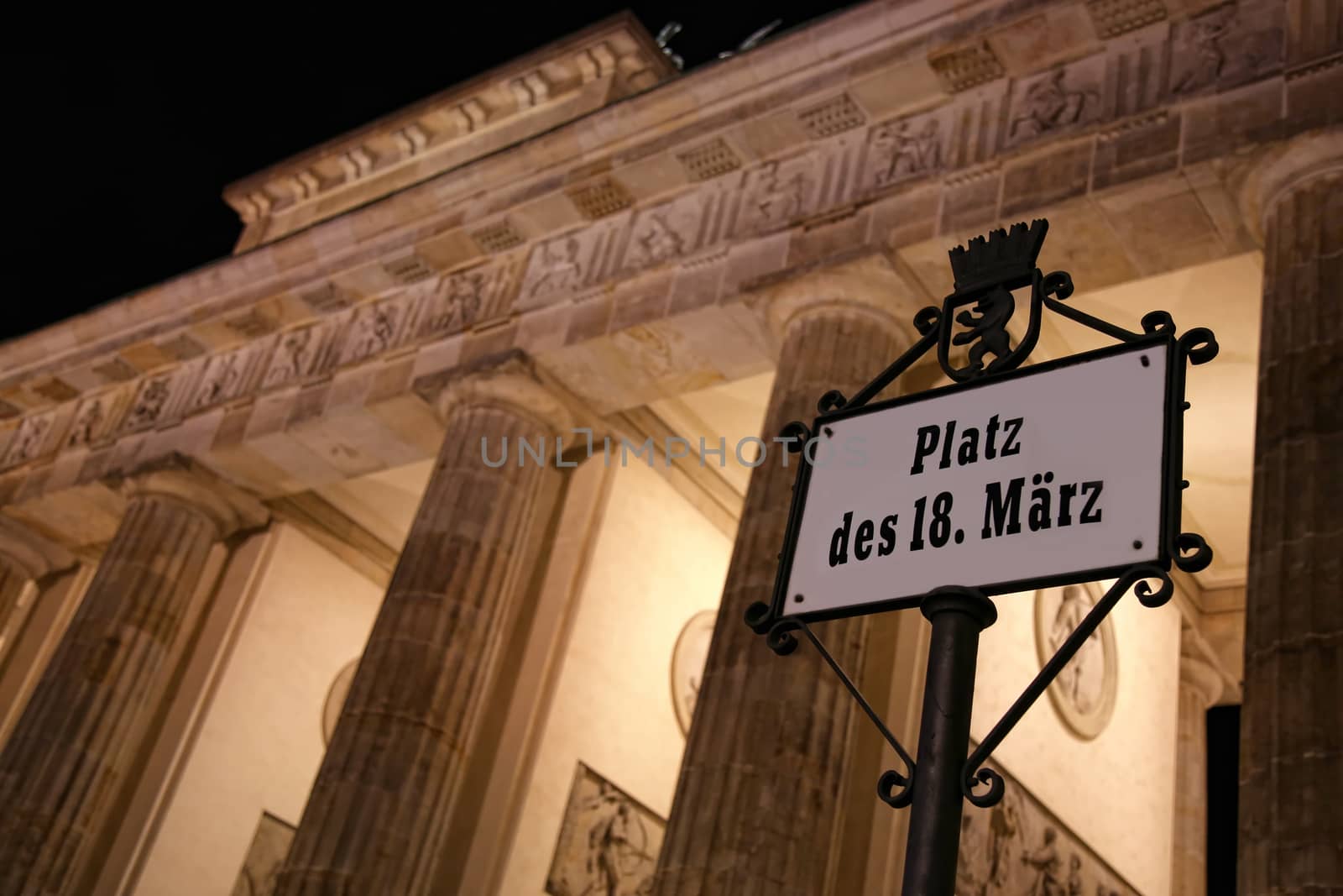 Brandenburg gate at night in Berlin, Germany by vladacanon