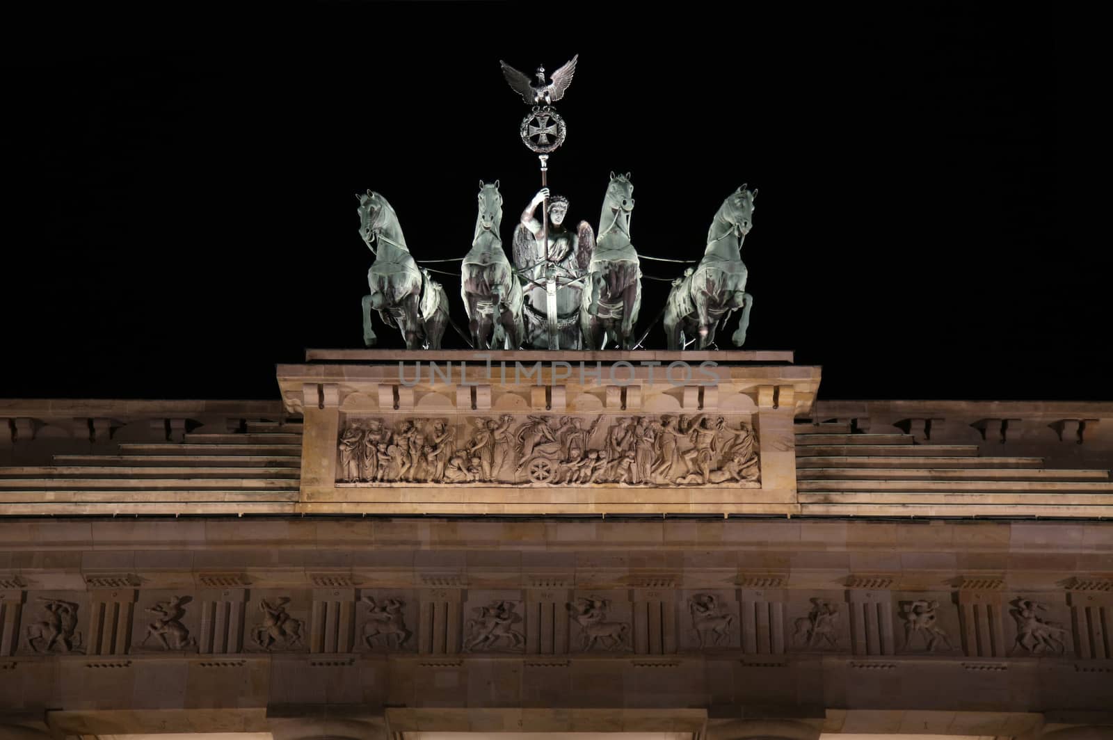 Brandenburg gate at night in Berlin, Germany by vladacanon