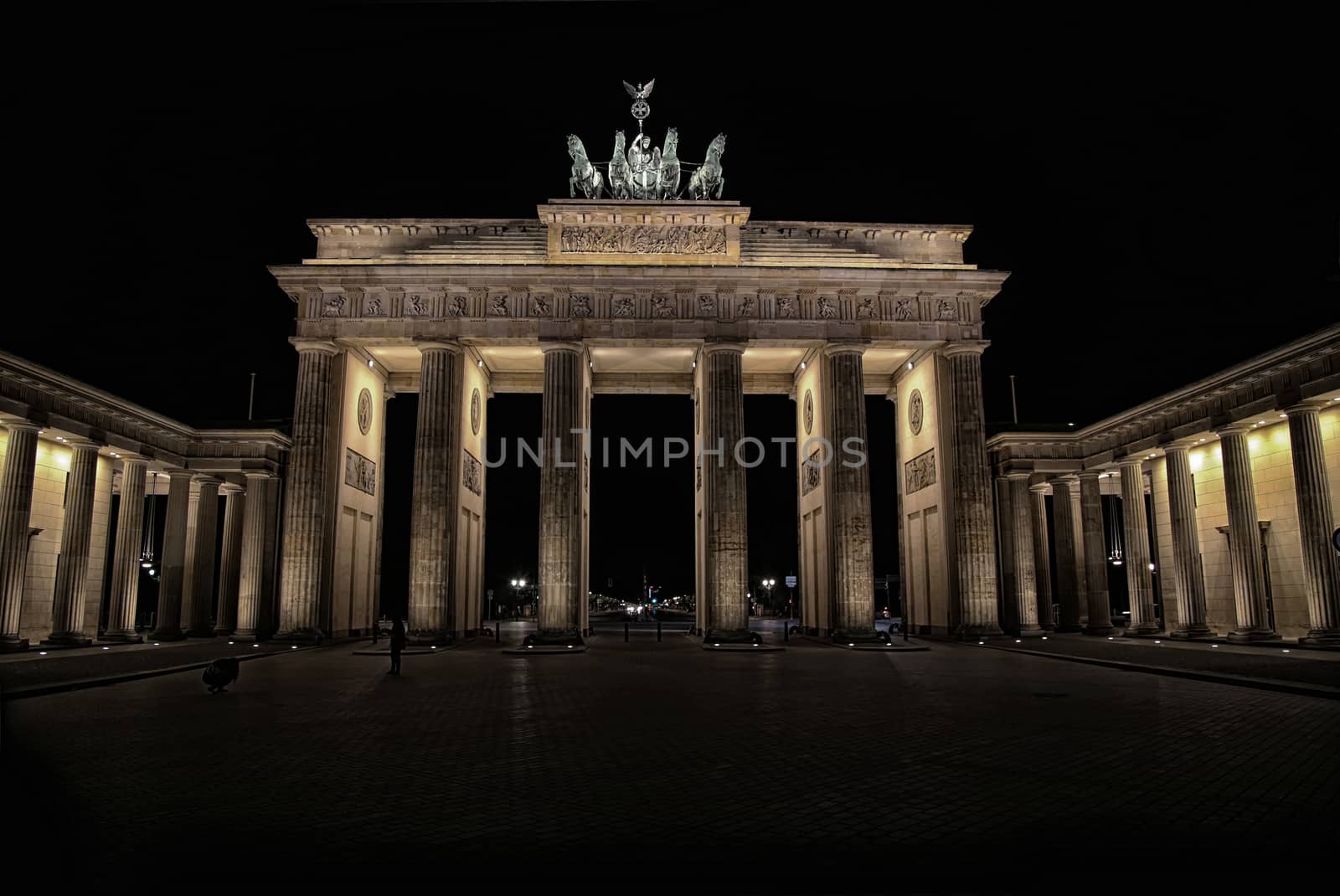 Brandenburg gate at night in Berlin, Germany by vladacanon