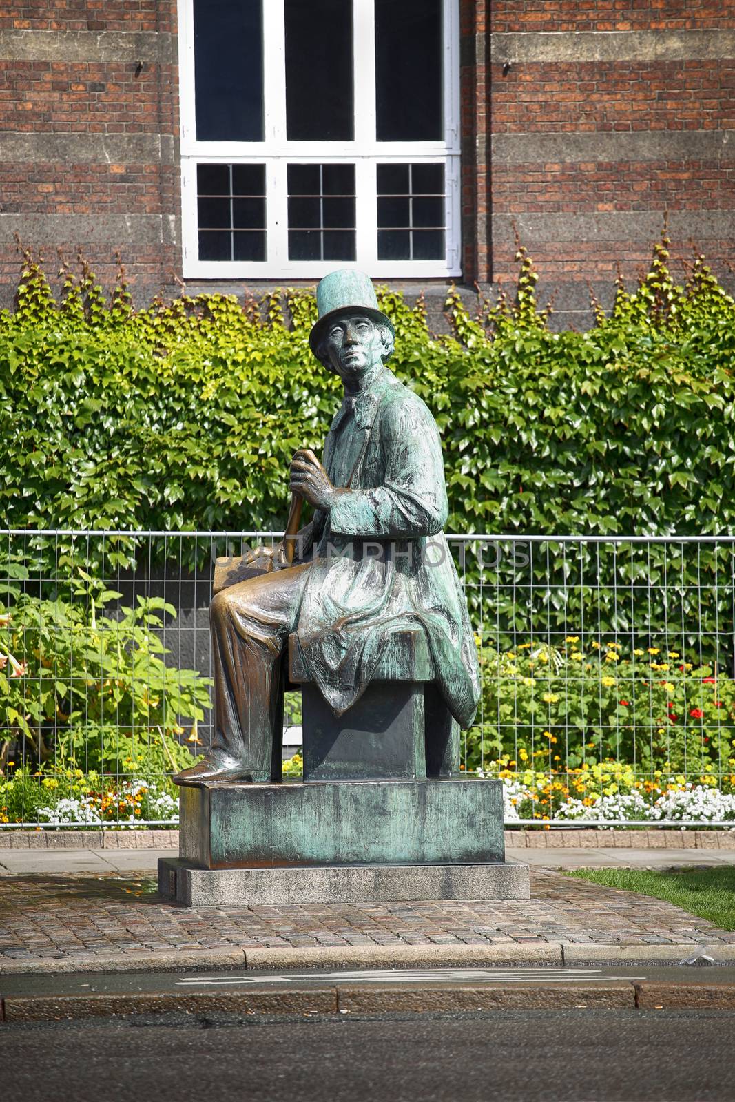 Monument of Hans Christian Andersen standing next to Radhus, Copenhagen city hall, Copenhagen, Denmark