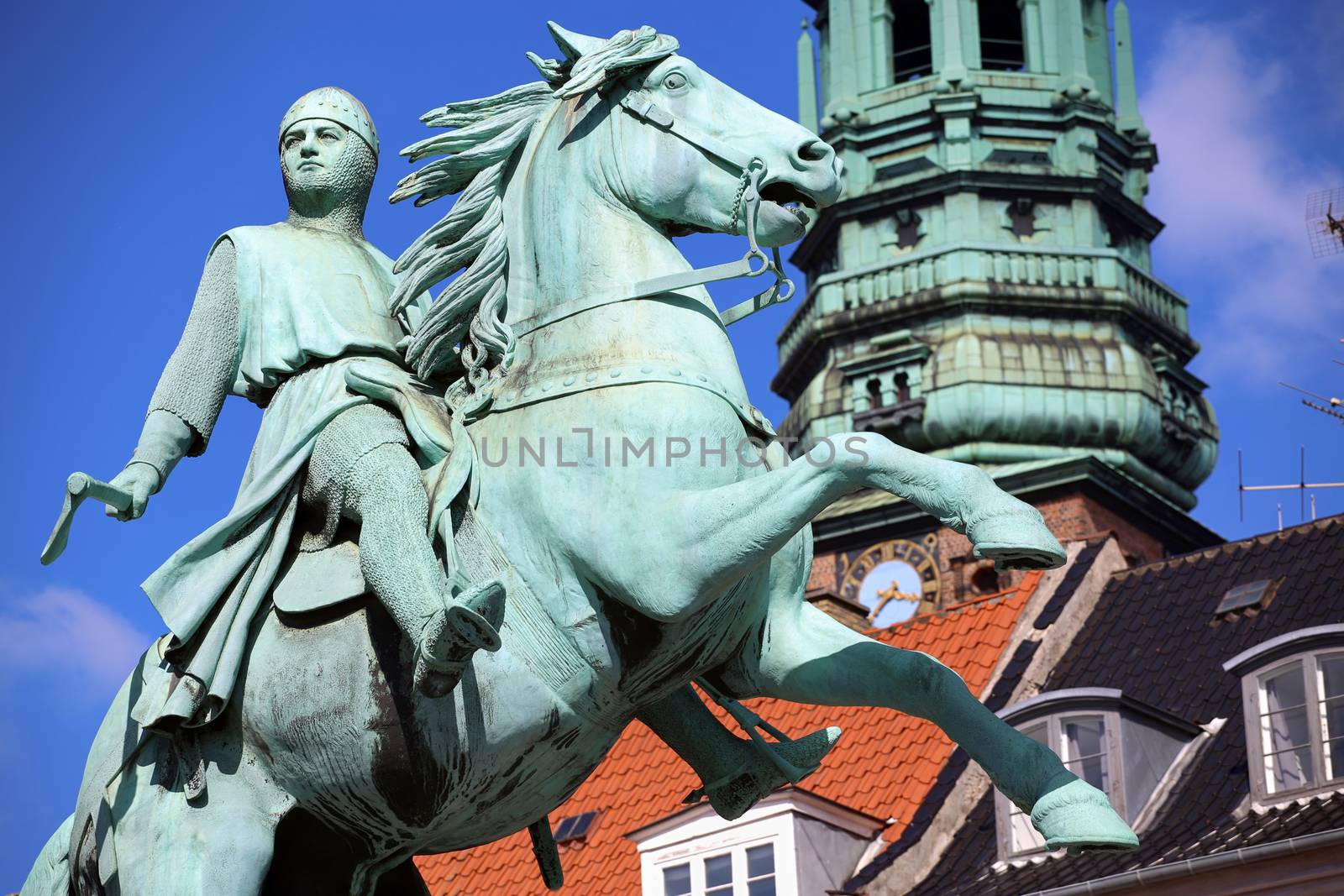 Hojbro Plads Square with the equestrian statue of Bishop Absalon and St Kunsthallen Nikolaj church in Copenhagen, Denmark