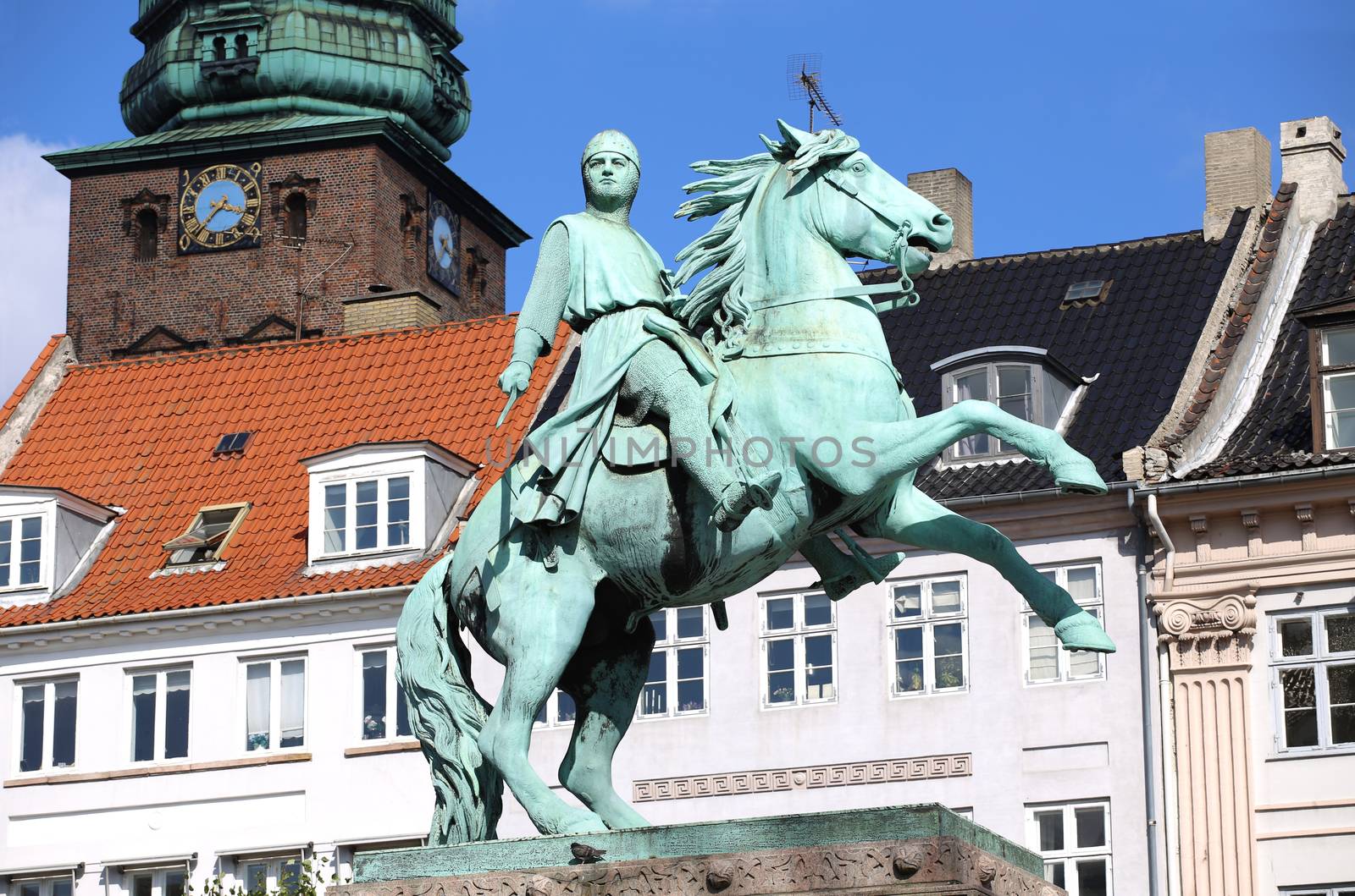 Hojbro Plads Square with the equestrian statue of Bishop Absalon and St Kunsthallen Nikolaj church in Copenhagen, Denmark