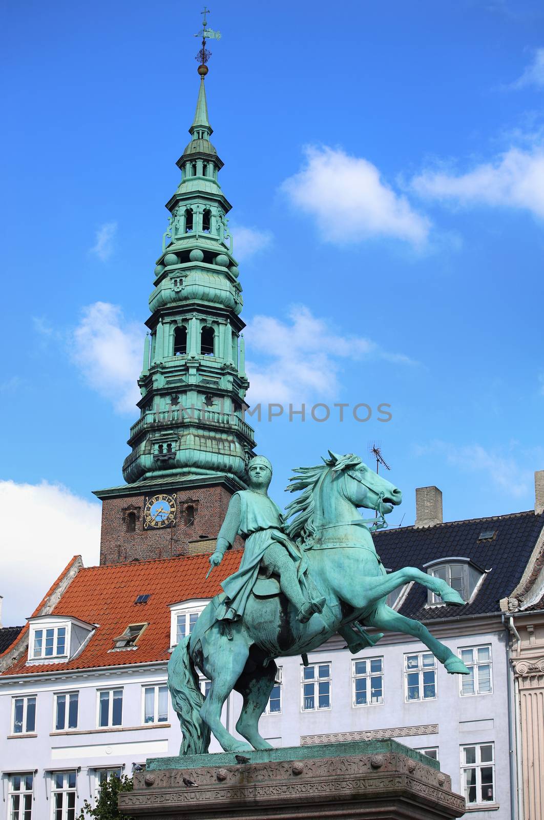 Hojbro Plads Square with the equestrian statue of Bishop Absalon and St Kunsthallen Nikolaj church in Copenhagen, Denmark