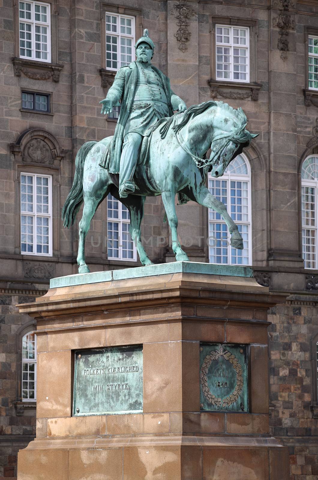 The equestrian statue of King Frederik VII in front of the Christiansborg Palace in Copenhagen, Denmark