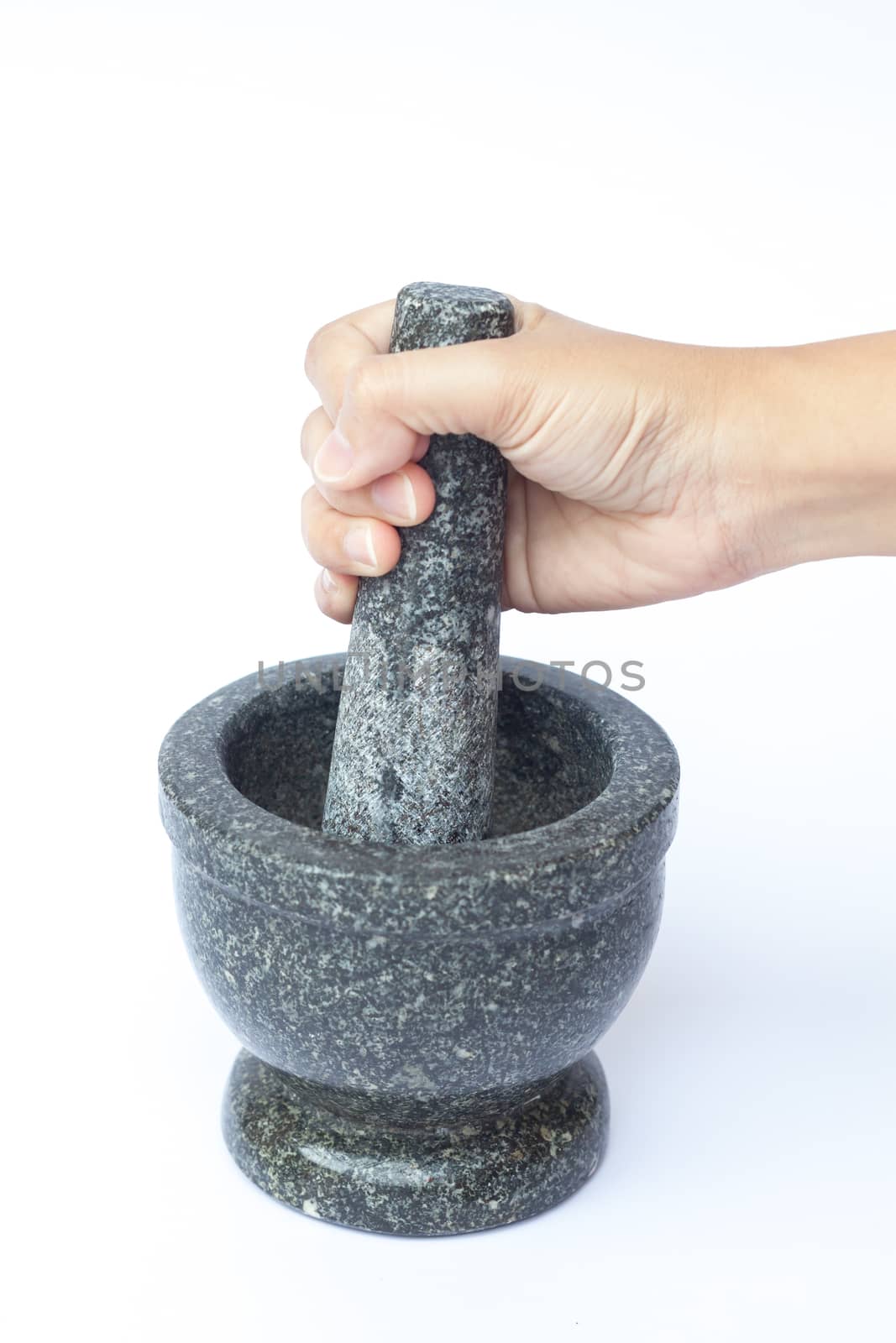 Stone mortar and pestle on white background by punsayaporn