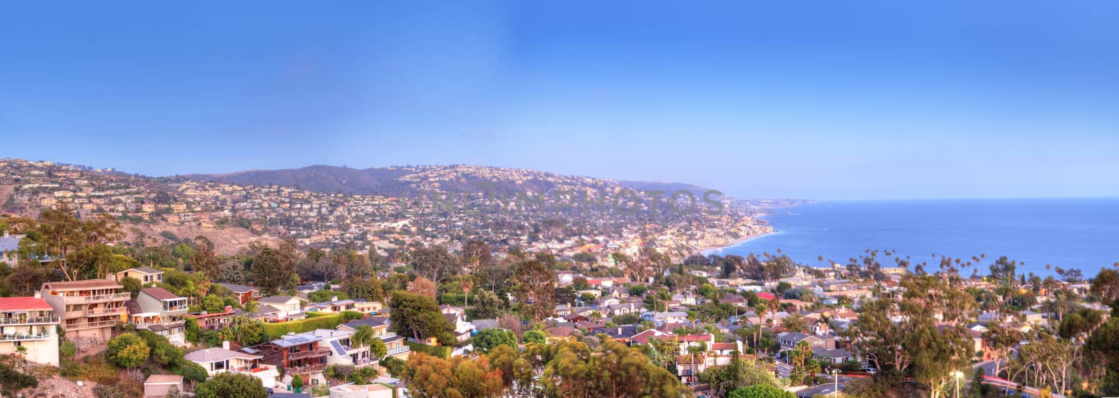 Blue sky over the coastline of Laguna Beach, California, in summer on a clear day with the ocean near sunset.