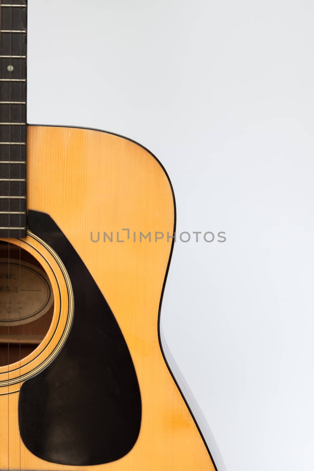 Acoustic guitar on white background, stock photo