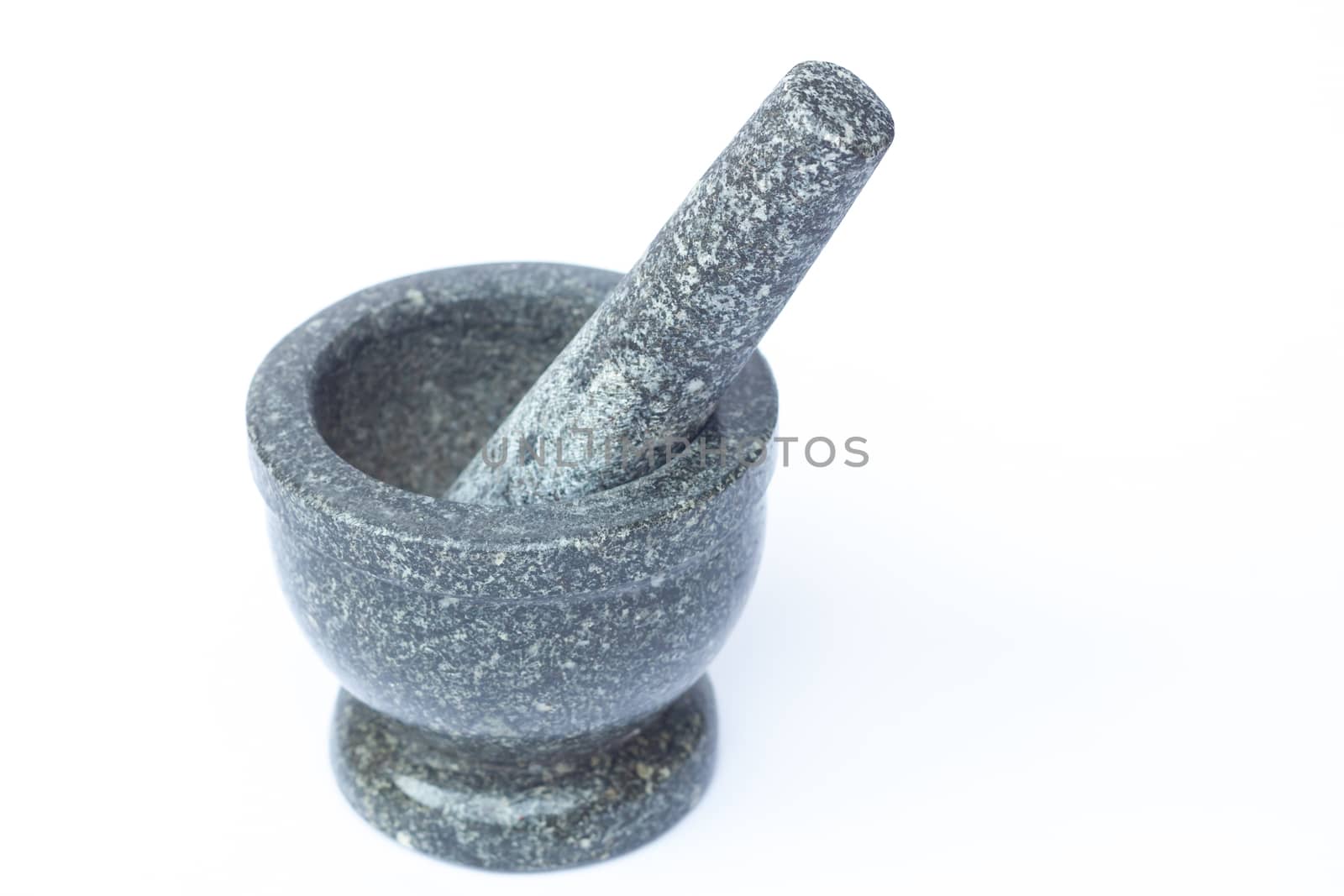 Stone mortar and pestle on white background, stock photo