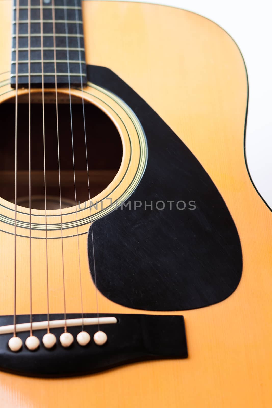 Acoustic guitar on white background, stock photo