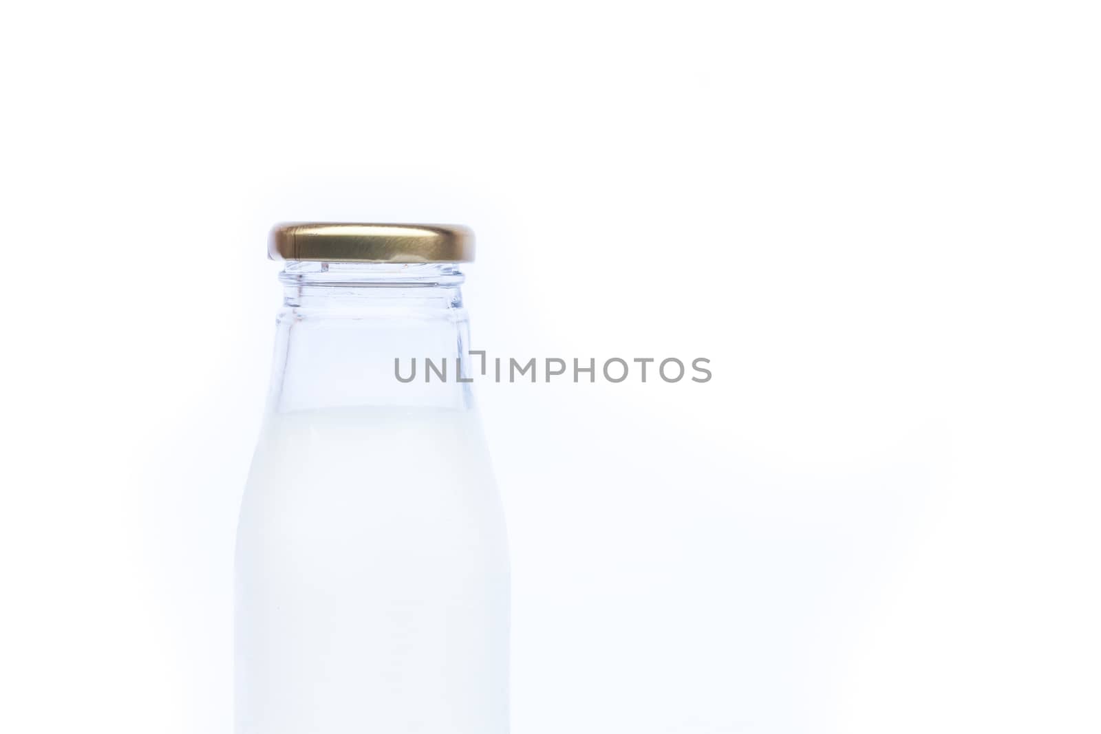 Traditional glass milk bottle on white background, stock photo