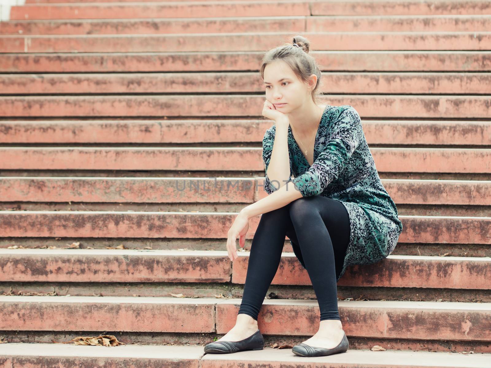 Sad girl sitting on steps by fascinadora