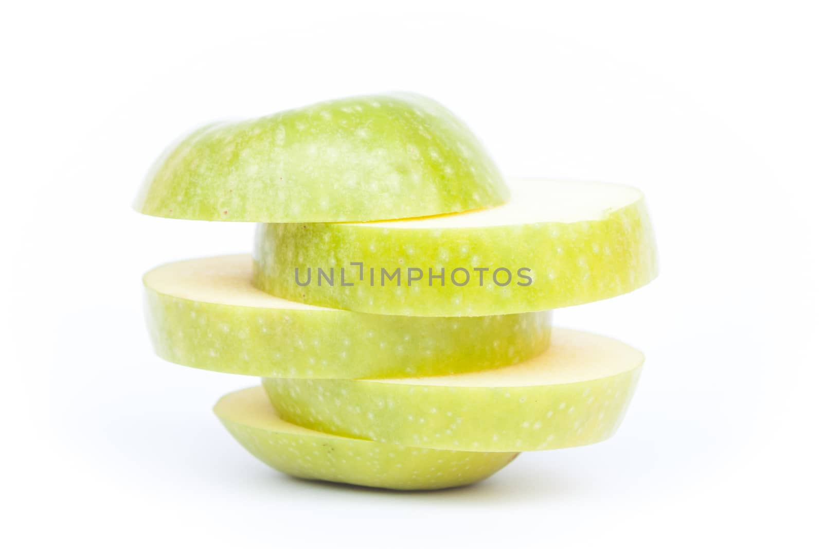 Sliced green apple on white background, stock photo