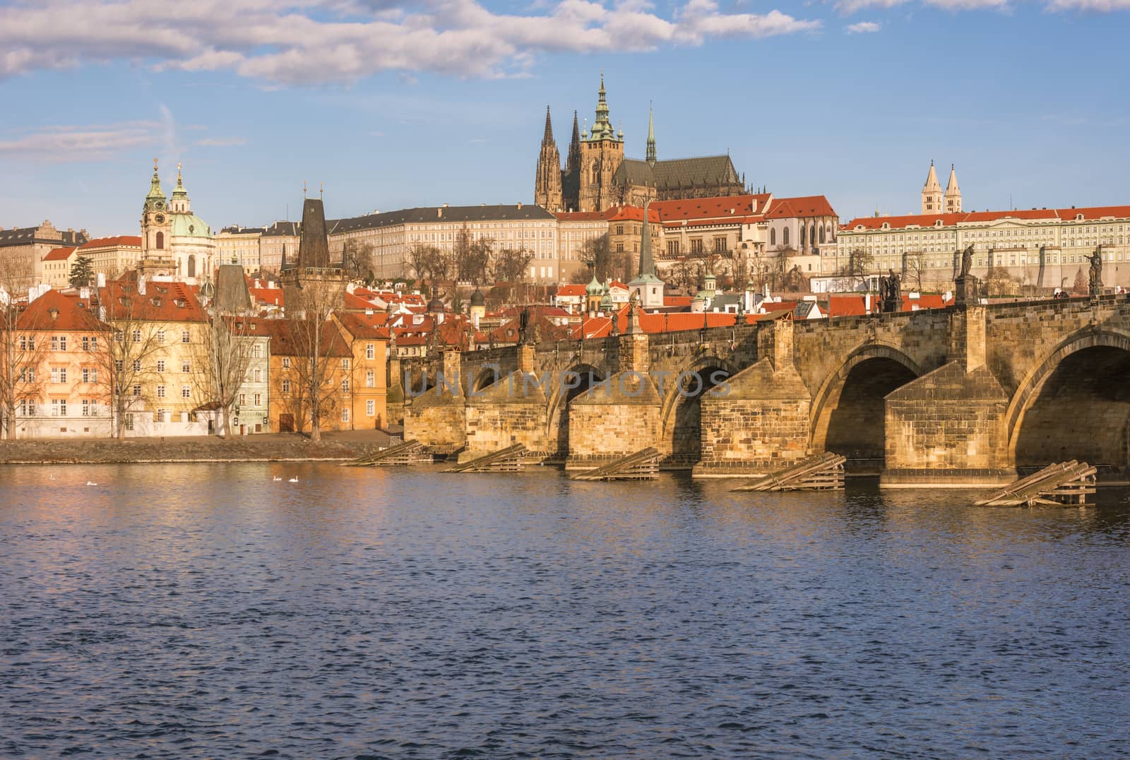 Cityscape with a section of the Charles Bridge and the river Vltava, which crosses Prague, Czech Republic.